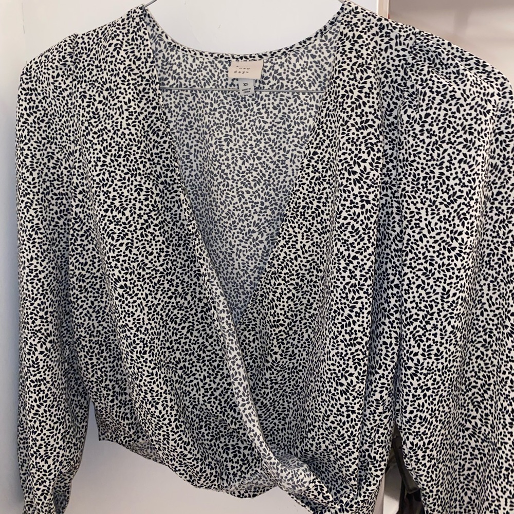 “ A new day” wrap printed top.